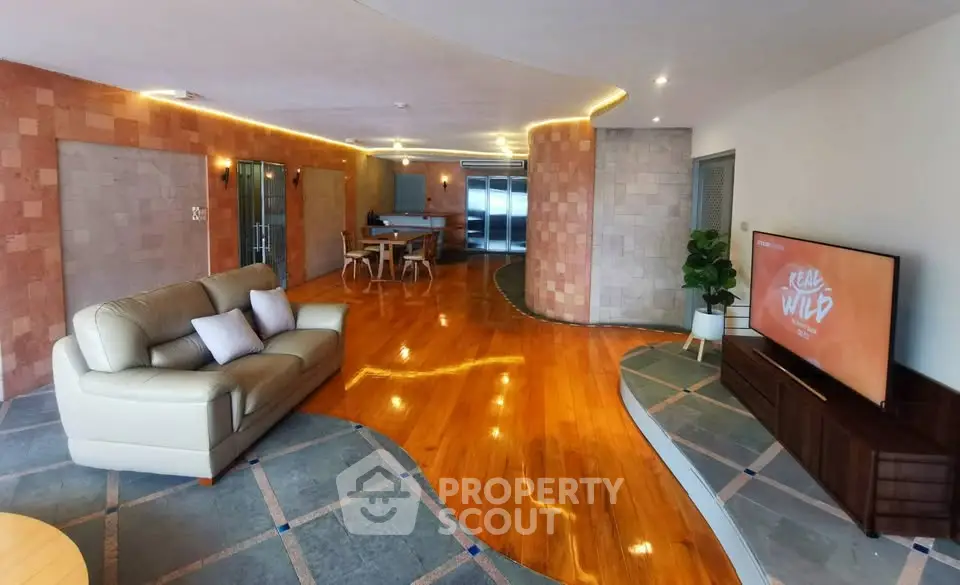 Spacious living room with modern design and wooden flooring