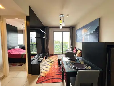 Modern open-plan living room with vibrant decor and balcony view