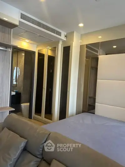 Modern bedroom with ensuite bathroom and stylish decor
