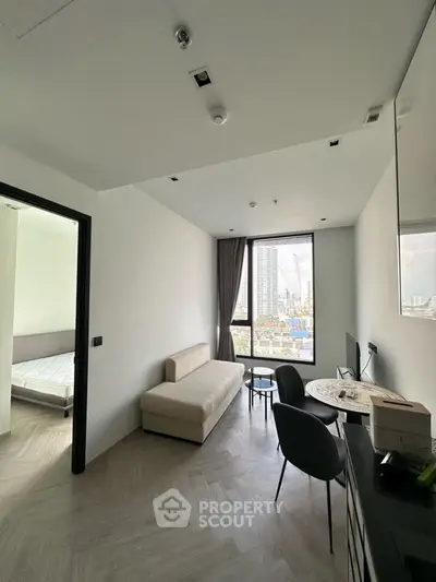 Modern apartment interior with city view, featuring a cozy living area and stylish decor.