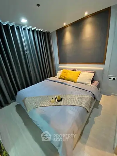 Cozy modern bedroom with stylish decor and ambient lighting