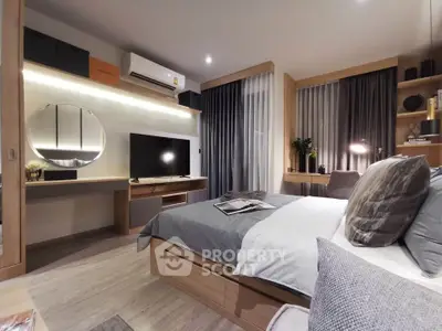 Modern bedroom with stylish decor, featuring a cozy bed, TV, and elegant lighting for a comfortable living experience.