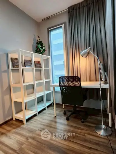 Modern study room with sleek desk, chair, and bookshelf, featuring large window and stylish flooring.