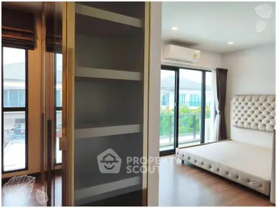 Modern bedroom with large windows and stylish decor in a luxurious apartment