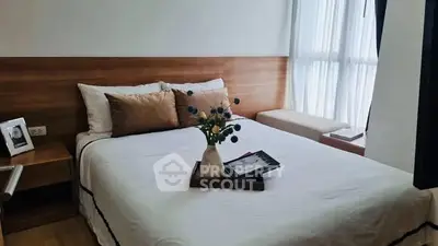 Cozy bedroom with stylish decor and natural light