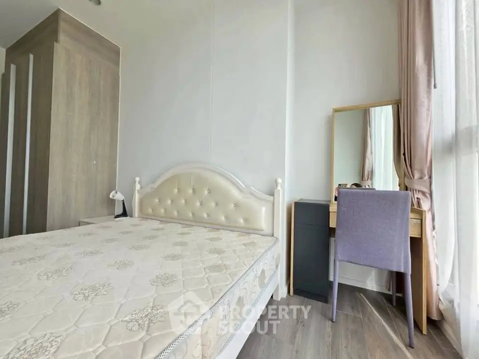 Bright bedroom with elegant bed and stylish vanity near large window