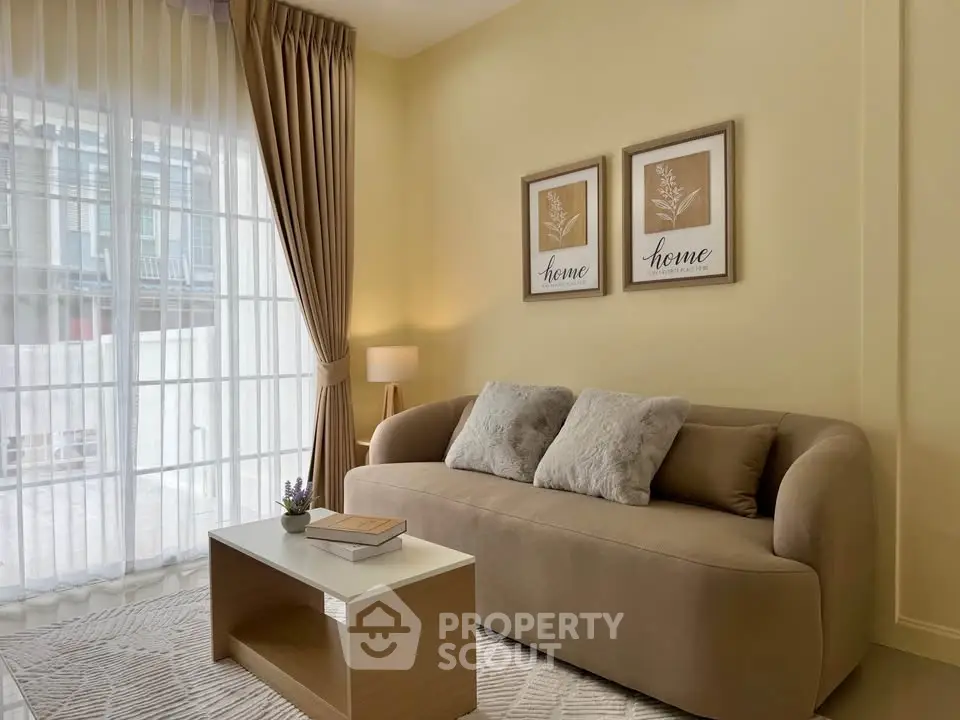 Cozy living room with modern sofa, elegant curtains, and stylish decor in a bright, inviting space.