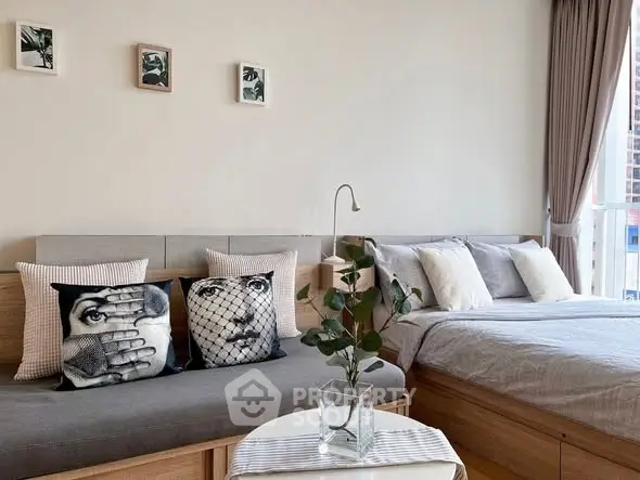 Modern bedroom with stylish decor and natural light