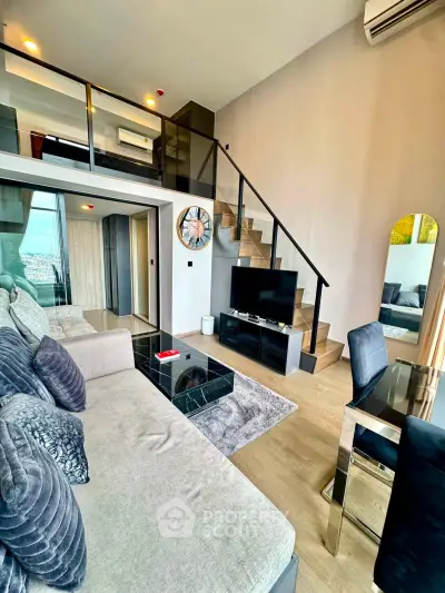 Modern duplex living room with stylish decor and mezzanine level