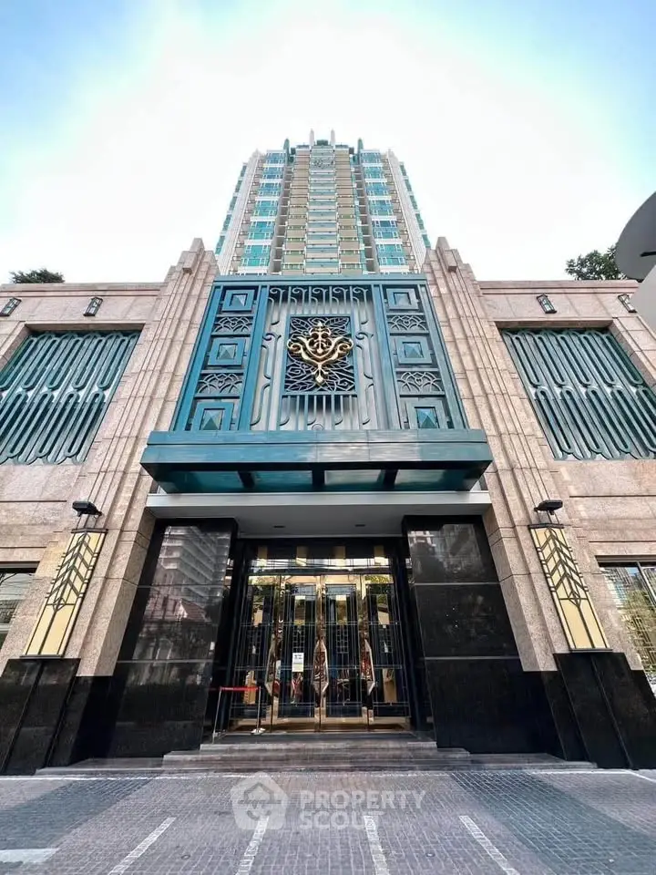 Stunning modern building entrance with elegant architectural design and tall glass facade.