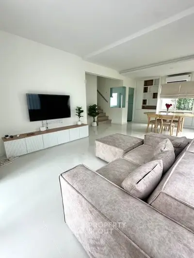 Spacious modern living room with sleek design and large sectional sofa