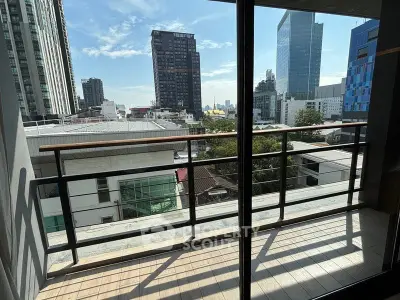 Spacious balcony with stunning city view in modern high-rise apartment
