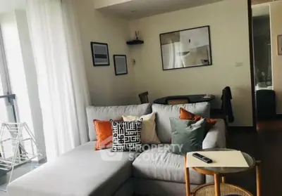 Stylish living room with modern decor and cozy seating area in a contemporary apartment.