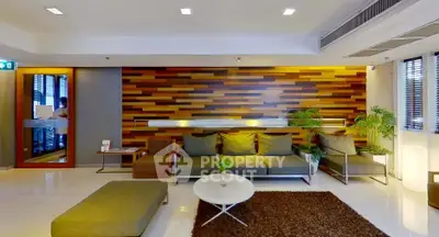 Modern living room with stylish wood panel wall and cozy seating area