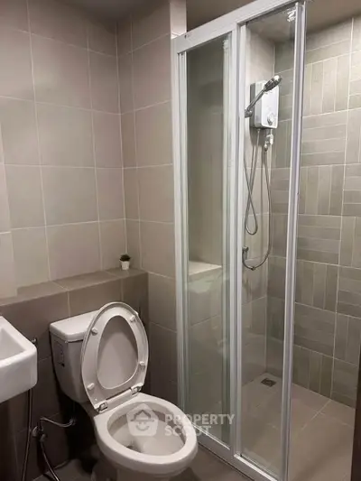 Modern bathroom with shower enclosure and sleek tile design