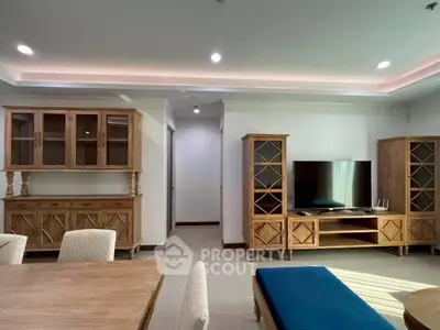 Spacious living room with elegant wooden furniture and modern lighting