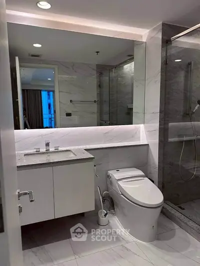 Luxurious modern bathroom with sleek fixtures and elegant marble finishes.