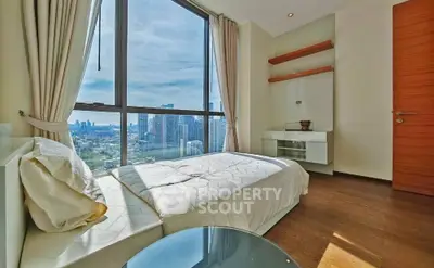 Modern bedroom with stunning city view and elegant decor