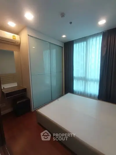 Modern bedroom with sleek design and ample natural light