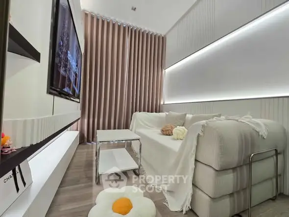 Modern living room with sleek design, cozy sofa, and ambient lighting