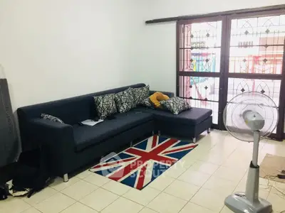 Cozy living room with sectional sofa and Union Jack rug