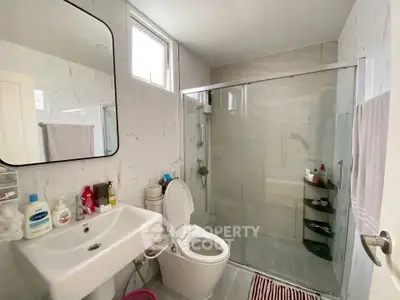 Modern bathroom with glass shower and sleek fixtures