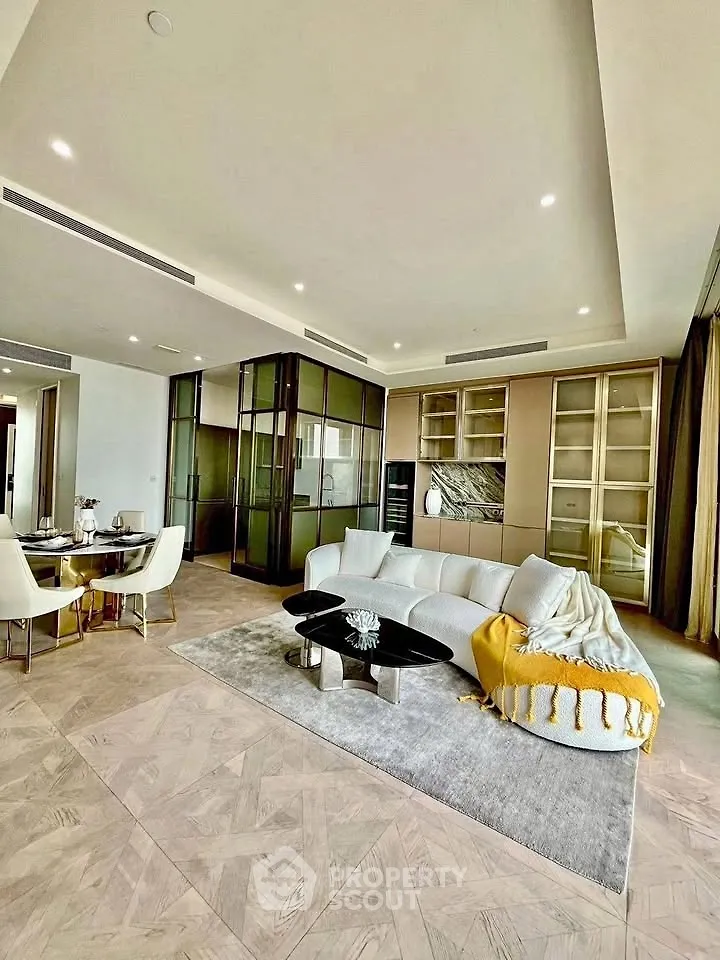 Luxurious modern living room with elegant decor and spacious layout, featuring stylish furniture and ambient lighting.