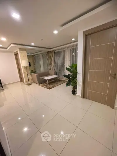 Spacious modern living room with elegant decor and large windows