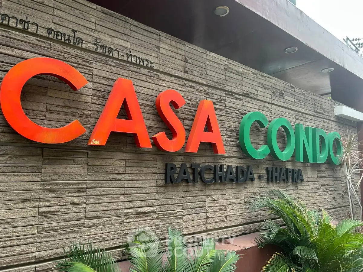 Casa Condo Ratchada-Thapra exterior signage with lush greenery