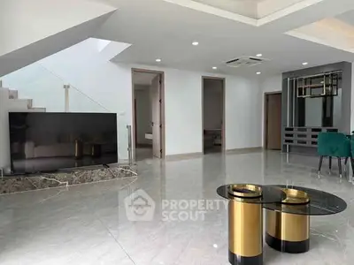 Spacious modern living room with sleek design and elegant furniture