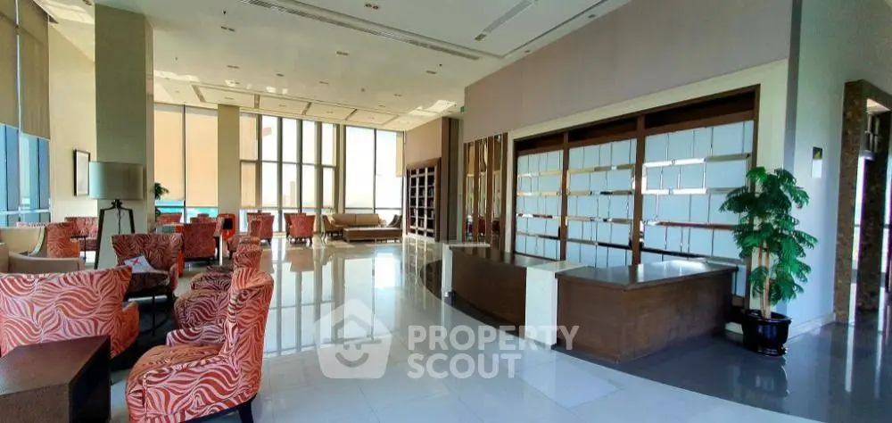 Luxurious modern lobby with elegant seating and large windows offering natural light.