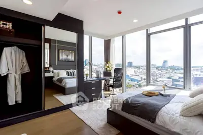 Luxurious bedroom with panoramic city view and modern furnishings.