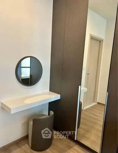 Modern bedroom with sleek wardrobe and stylish vanity area