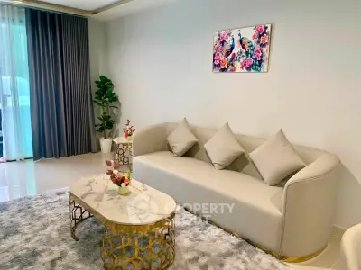 Elegant living room with modern sofa, chic coffee table, and vibrant wall art, perfect for stylish urban living.