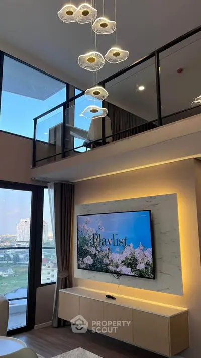 Luxurious modern living room with high ceiling, elegant chandelier, and large windows offering stunning city views.
