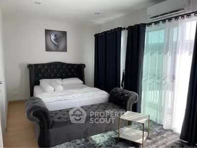 Luxurious bedroom with elegant decor and natural light