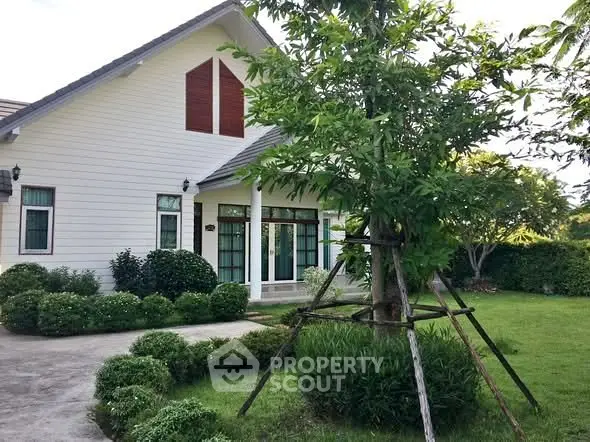 Charming suburban home with lush garden and spacious lawn, perfect for family living.