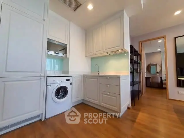 Modern kitchen with integrated appliances and sleek cabinetry