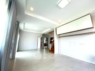 Spacious modern living room with sleek design and ample natural light