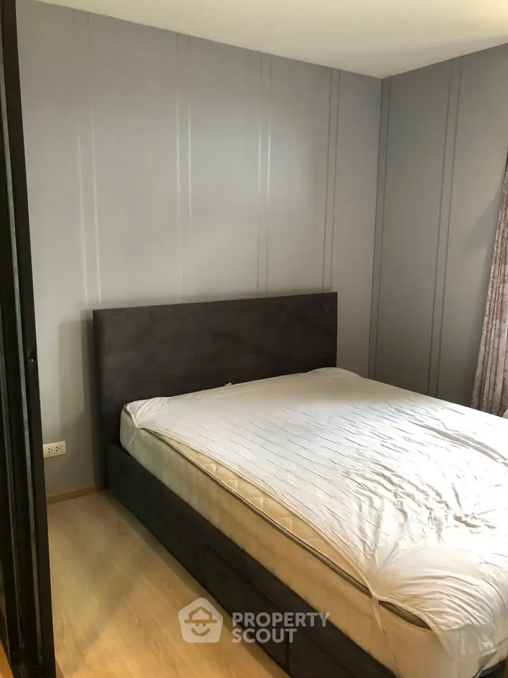 Cozy bedroom with modern design and comfortable bed in a stylish apartment.