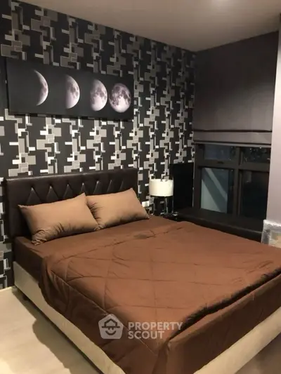 Modern bedroom with stylish decor and moon phase artwork