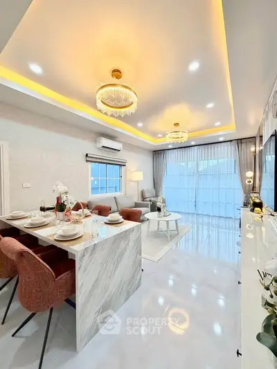 Luxurious open-plan living room with elegant lighting and modern decor