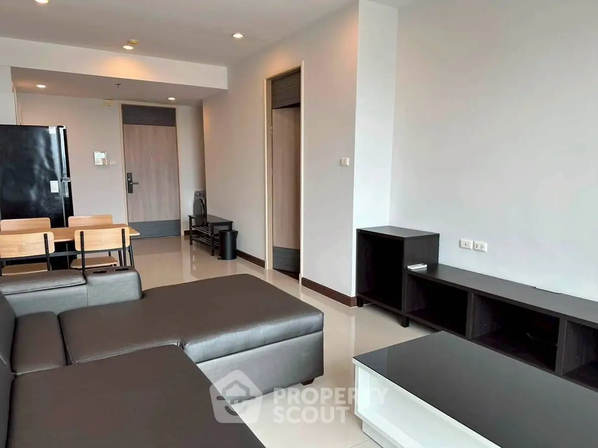 Modern living room with sleek furniture and open layout in a contemporary apartment.