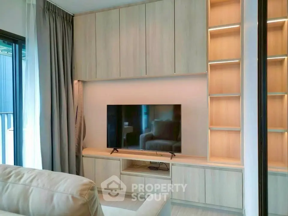 Modern living room with built-in wooden cabinets and sleek TV setup