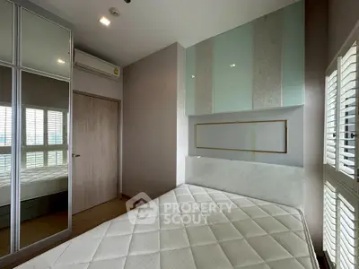 Modern bedroom with mirrored wardrobe and stylish decor