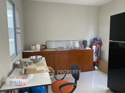 Spacious kitchen with modern appliances and ample storage space, perfect for culinary enthusiasts.