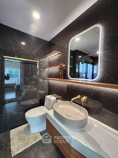 Luxurious modern bathroom with elegant fixtures and ambient lighting