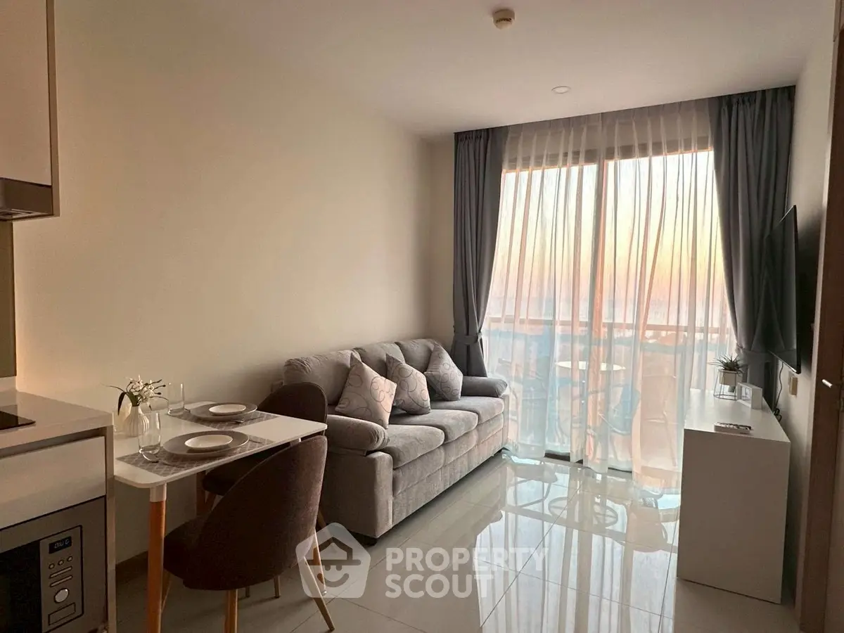 Cozy living room with sunset view, modern furniture, and elegant decor.