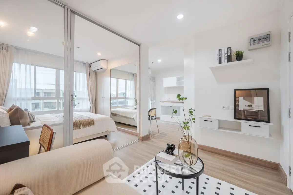 Modern open-plan living room with stylish decor and natural light