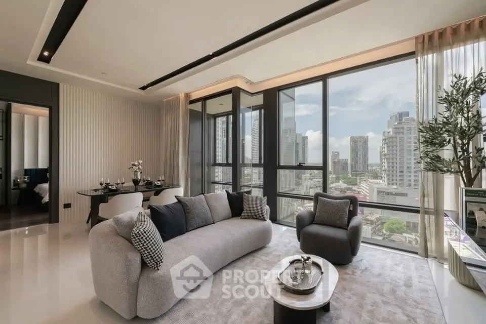 Luxurious modern living room with panoramic city views and elegant furnishings.